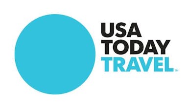 A blue circle is on the left, black text that says "USA Today" is on the right, with "Travel" in blue below it. 
